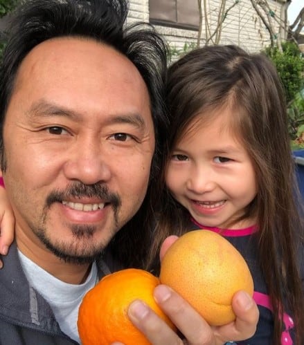 Image of renowned surgeon, Dr. Duc Vuong with his daughter