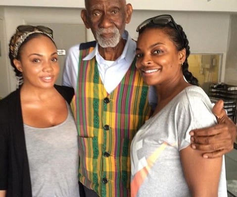 Image of a popular herbalist, Dr. Sebi and his daughter